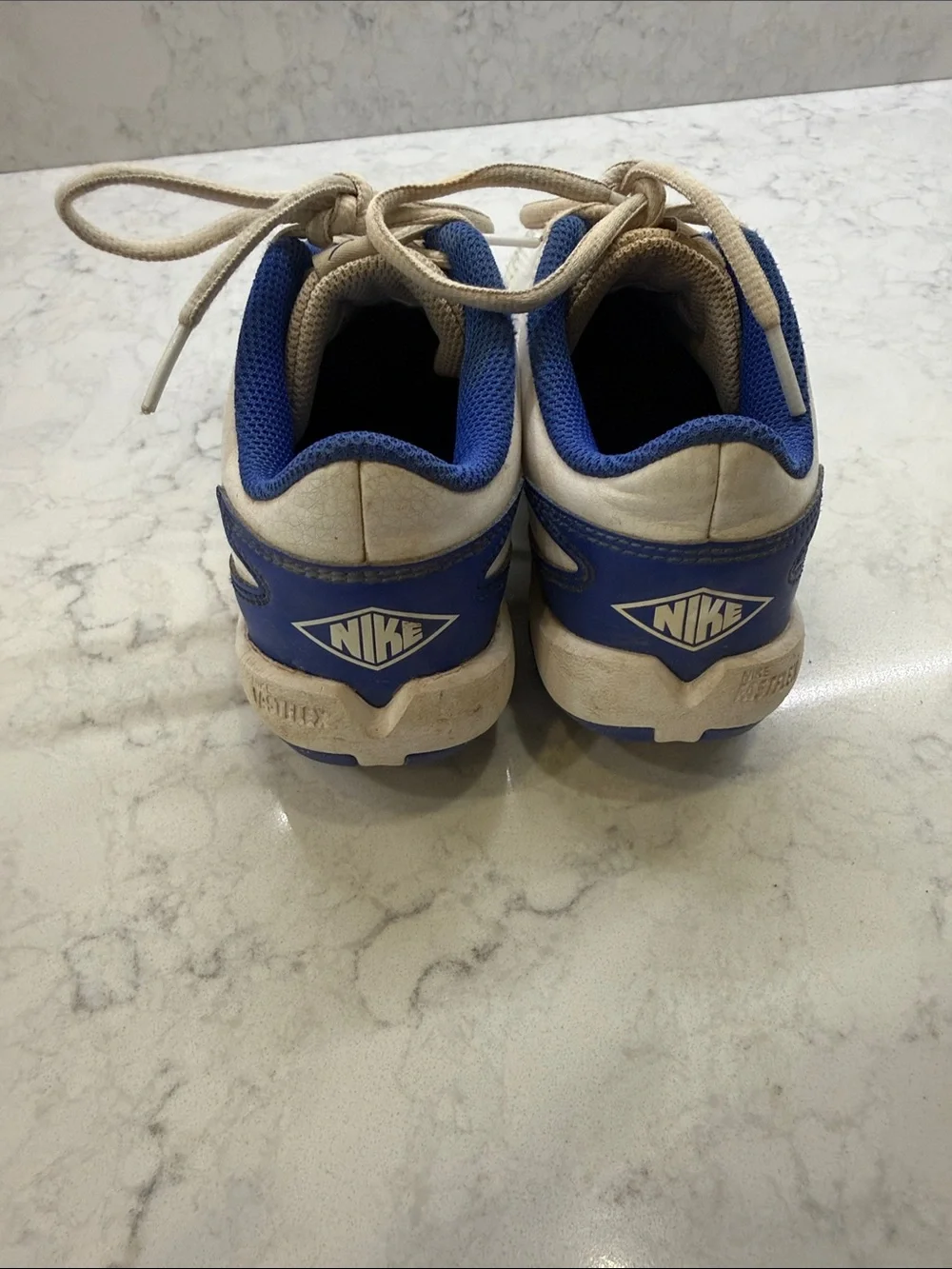 Nike Kids White and Blue Cleats, Size 2